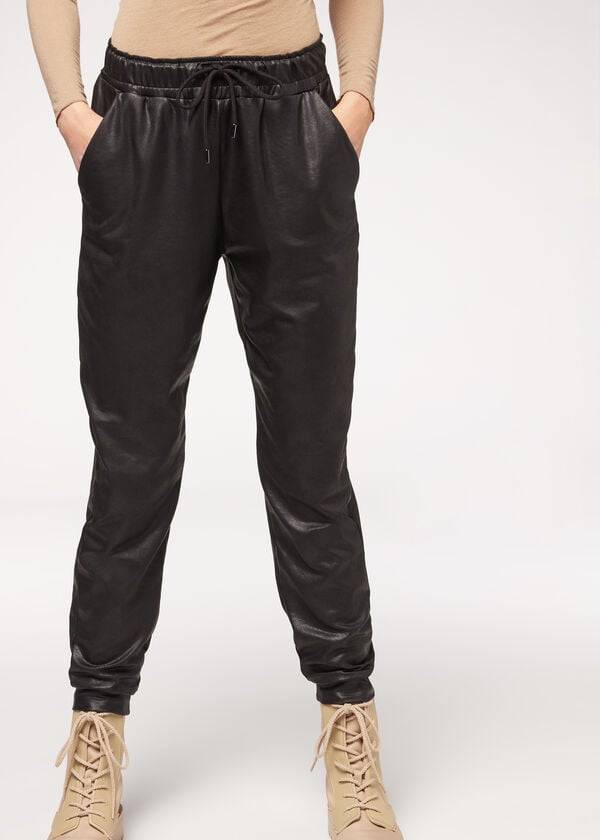 pantalones térmicos negros de efecto cuero de calzedonia para mujer