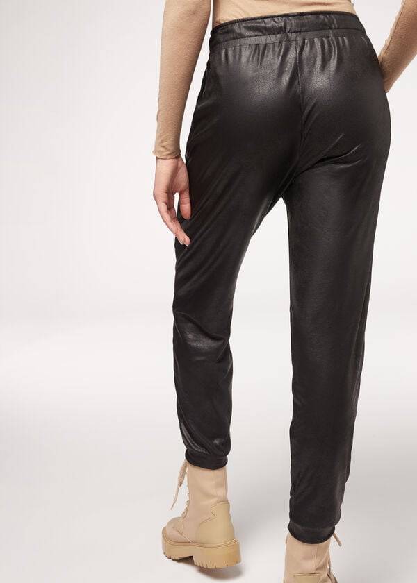 pantalones térmicos negros de efecto cuero de calzedonia para mujer
