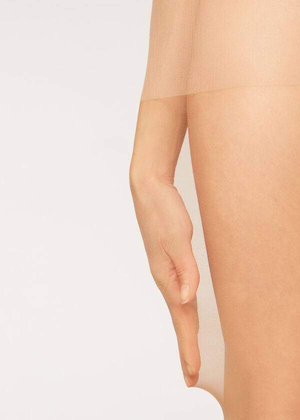 medias transparentes de media altura action de 40 deniers de calzedonia para mujer color beige