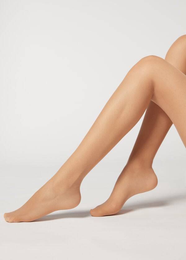 medias transparentes de media altura action de 40 deniers de calzedonia para mujer color beige
